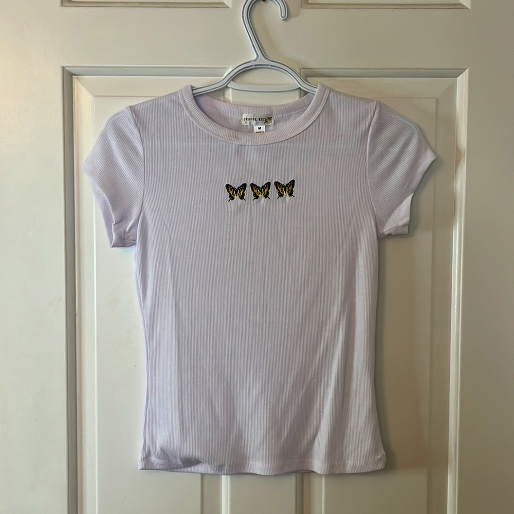 White tee with embroidered butterfly’s